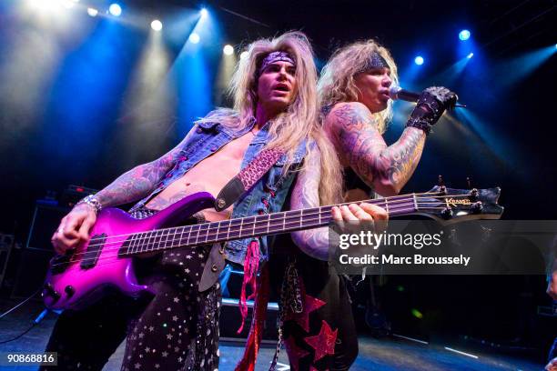 Lexxi Foxx and Michael Starr of Steel Panther perform on stage at Shepherds Bush Empire on September 16, 2009 in London, England.