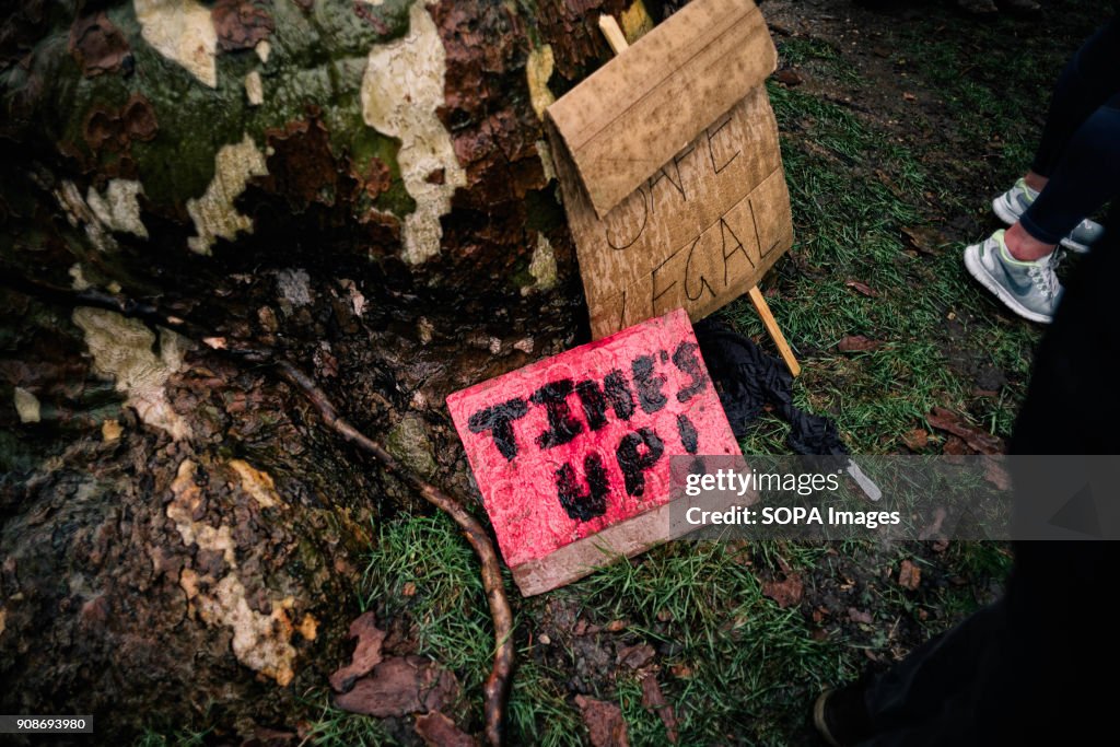 Several placards and poster lying down the floor seen during...