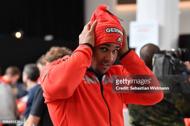 Joshua Bluhm tries on a hat during the 2018 PyeongChang Olympic Games German Team kit handover at Postpalast on January 22, 2018 in Munich, Germany.
