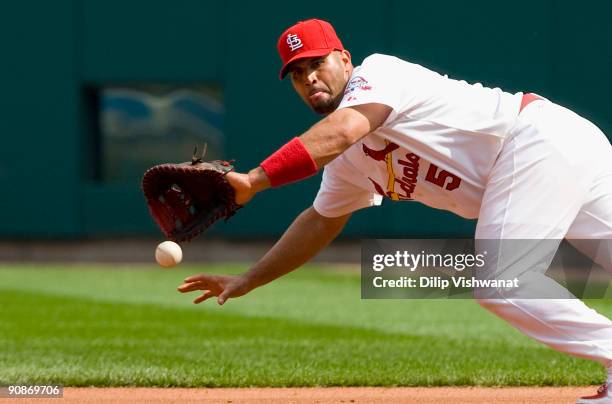 Albert Pujols of the St. Louis Cardinals fields a line drive against the Florida Marlins on September 16, 2009 at Busch Stadium in St. Louis,...