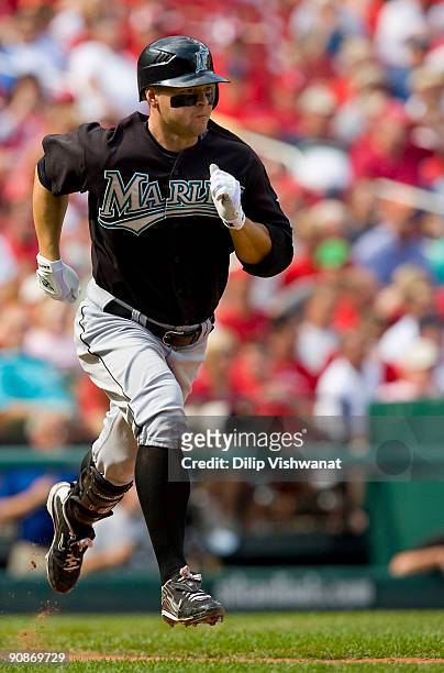 Cody Ross of the Florida Marlins runs to first base against the St. Louis Cardinals on September 16, 2009 at Busch Stadium in St. Louis, Missouri....