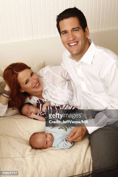 Molly Ringwald, her husband Panio Gianopoulos and their new twins Adele Georgina and Roman Stylianos pose during a photo shoot on July 29, 2009 in...