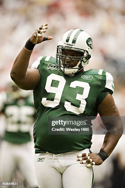 Marques Douglas of the New York Jets signals to the sidelines for water during a game against the Houston Texans at Reliant Stadium on September 13,...