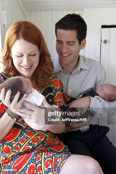 Molly Ringwald, her husband Panio Gianopoulos pose with their new twins Adele Georgina and Roman Stylianos during a photo shoot on July 29, 2009 in...