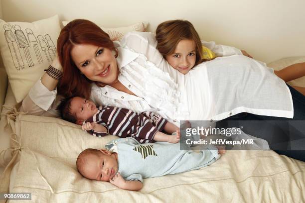 Molly Ringwald poses with her newborn twins Adele Georgina and Roman Stylianos and daughter Mathilda Ereni during a photo shoot on July 29, 2009 in...