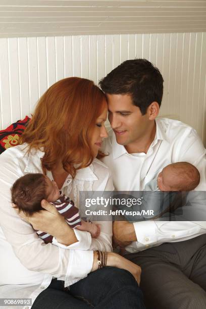 Molly Ringwald, her husband Panio Gianopoulos and their new twins Adele Georgina and Roman Stylianos pose during a photo shoot on July 29, 2009 in...