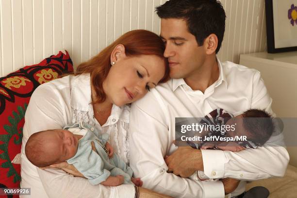 Molly Ringwald, her husband Panio Gianopoulos and their new twins Adele Georgina and Roman Stylianos pose during a photo shoot on July 29, 2009 in...