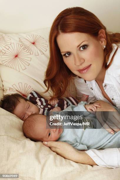 Molly Ringwald poses with her new twins Adele Georgina and Roman Stylianos during a photo shoot on July 29, 2009 in Los Angeles, California.