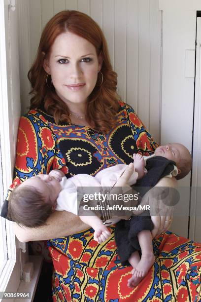 Molly Ringwald poses with her new twins Adele Georgina and Roman Stylianos during a photo shoot on July 29, 2009 in Los Angeles, California.