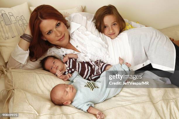 Molly Ringwald poses with her newborn twins Adele Georgina and Roman Stylianos and daughter Mathilda Ereni during a photo shoot on July 29, 2009 in...