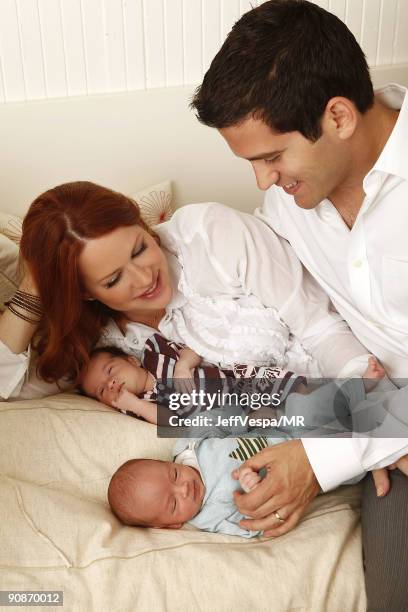 Molly Ringwald, her husband Panio Gianopoulos and their new twins Adele Georgina and Roman Stylianos pose during a photo shoot on July 29, 2009 in...