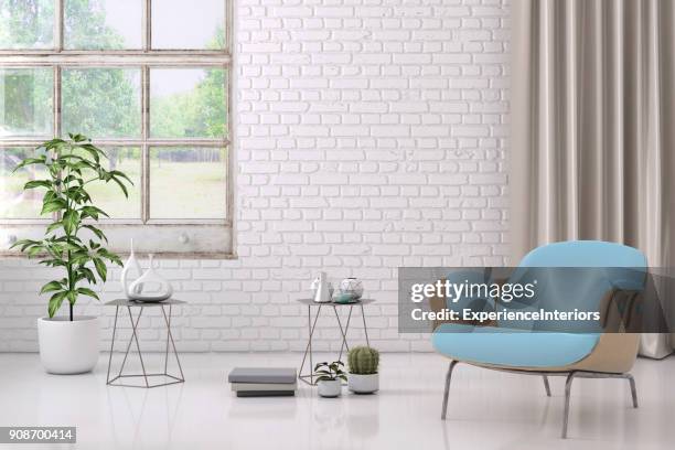 blaue farbige sessel mit couchtisch, blumen und leeren wandschablone - table brick wall wood stock-fotos und bilder