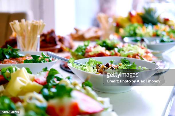 salads and snacks on a table - buffet stock-fotos und bilder