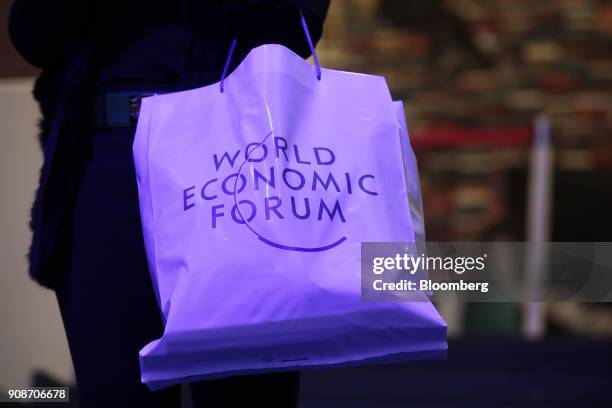 World Economic Forum logo sits on a bag inside the Congress Center ahead of the World Economic Forum in Davos, Switzerland, on Monday, Jan. 22, 2018....