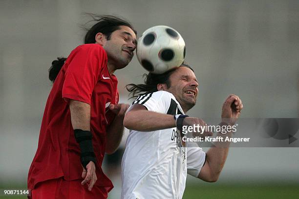 Moritz Rinke of Germany challenges for the ball with Dogu Yuecel of Turkey during the DFB Writers League match between Germany and Turkey at the...