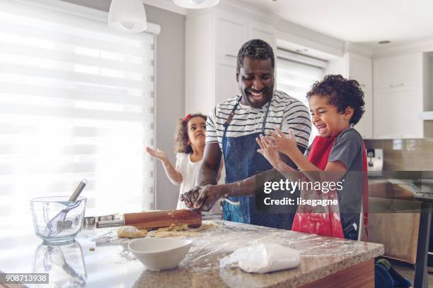 father cooking with kids - cook stock pictures, royalty-free photos & images