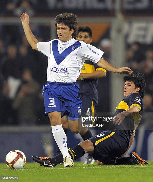 Argentine Velez Sarsfield's Emiliano Papa vies for the ball with Argentine Boca Juniors' Gary Medel during their Copa Sudamericana football match, at...