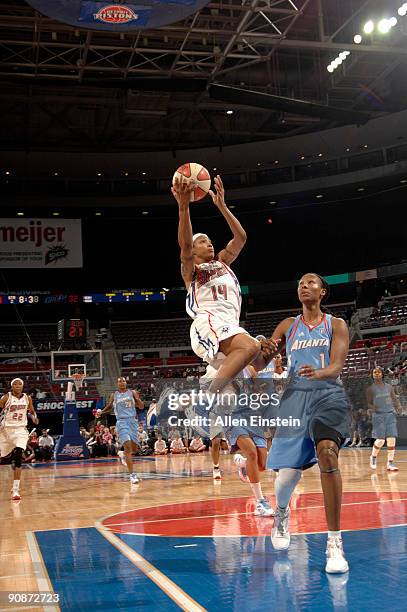 Deanna Nolan of the Detroit Shock puts up a layup against Chamique Holdsclaw of the Atlanta Dream in Game One of the WNBA Eastern Conference...