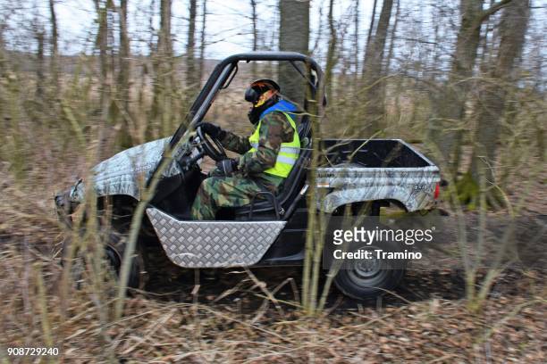 yamaha rhino 660 in motion in the forest - side by side atv stock pictures, royalty-free photos & images