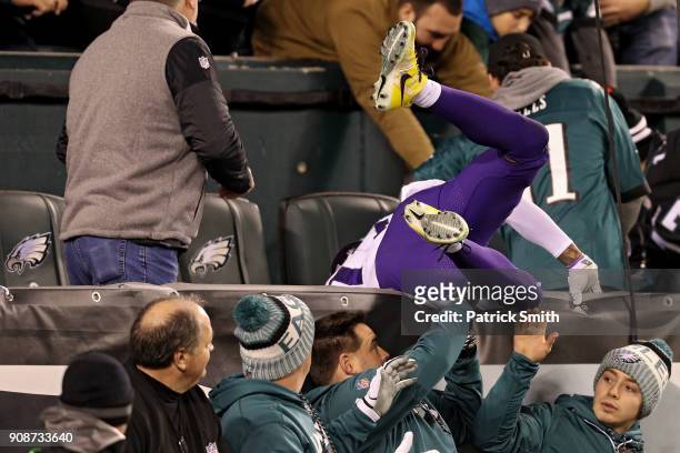 Wide receiver Jarius Wright of the Minnesota Vikings crashes into the stands after missing a reception against the Philadelphia Eagles in the fourth...