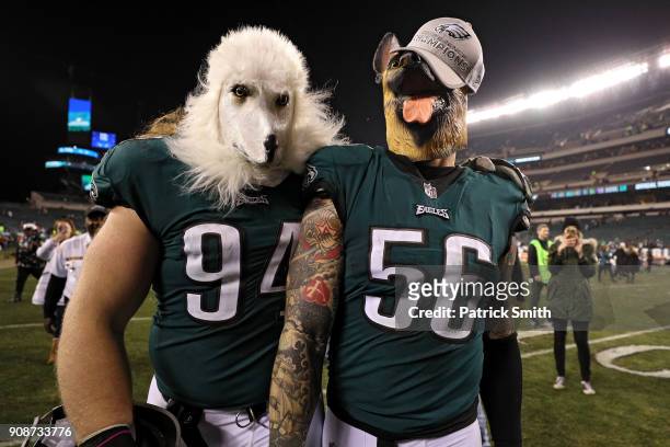 Beau Allen and Chris Long of the Philadelphia Eagles celebrates their teams win while wearing a dog masks over the Minnesota Vikings in the NFC...