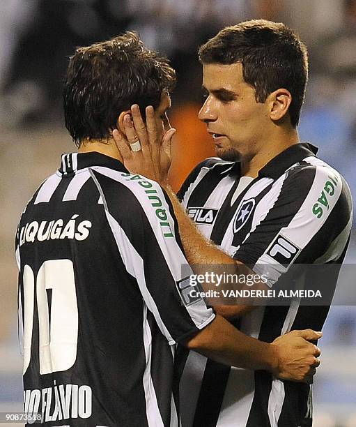 Lucio Flavio of Brazilian Botafogo FC celebrates with teammate Andre Lima after scoring against Brazilian Atletico PR during their Copa Sudamericana...