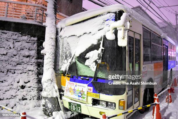 Commuter bus hits an electric pole on January 22, 2018 in Yokohama, Kanagawa, Japan. The Japan Meteorological Agency is forecasting 20 cm of snow in...
