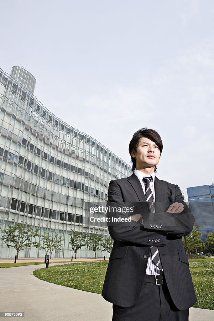 Businessman crossing arms, looking away