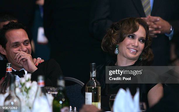 Singers Marc Anthony and Jennifer Lopez watch President Barack Obama and First Lady Michelle Obama during the Congressional Hispanic Caucus Institute...