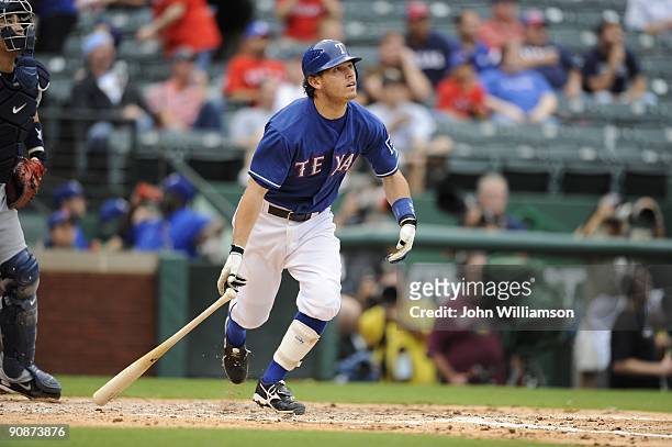 Ian Kinsler of the Texas Rangers bats and runs to first base from the batter's box during the game against the Seattle Mariners at Rangers Ballpark...