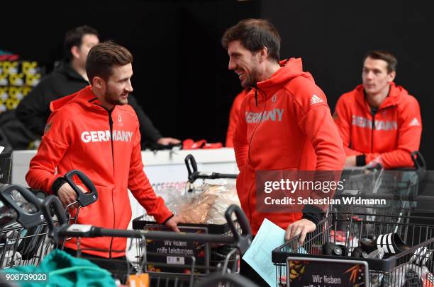 Markus Eisenbichler and Arnd Peiffer talk during the 2018 PyeongChang Olympic Games German Team kit handover at Postpalast on January 22, 2018 in...