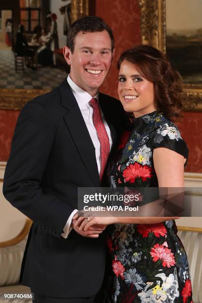 Princess Eugenie and Jack Brooksbank pose in the Picture Gallery at Buckingham Palace after they announced their engagement. Princess Eugenie wears a...