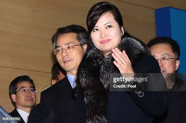 Hyon Song-wol, head of the North Korea's Samjiyon Orchestra, waves as she arrives at the customs, immigration and quarantine office for departure to...