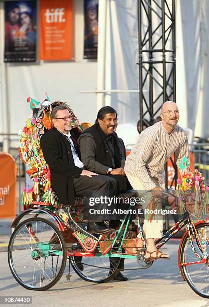 Producer David Hamilton and writer/director Dilip Mehta arrive via rickshaw at the "Cooking With Stella" screening during the 2009 Toronto...