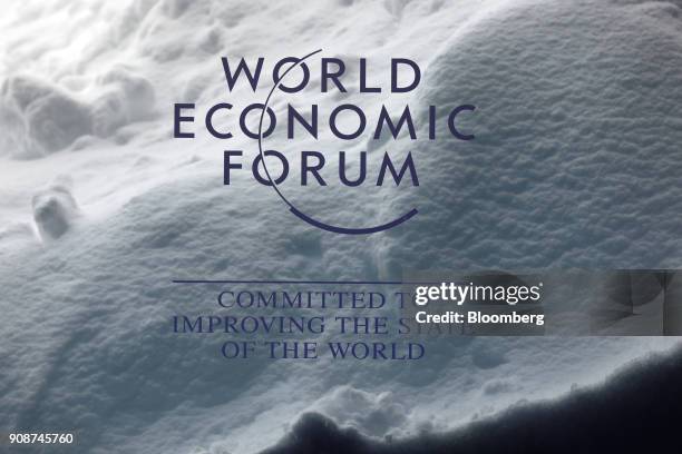 World Economic Forum sign stands inside the Congress Center as a drift of heavy snow sits behind ahead of the World Economic Forum in Davos,...