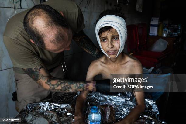 Thomas being rescued and treated by a military medic. In the past few days, more and more children have been either found in the rubble or are...
