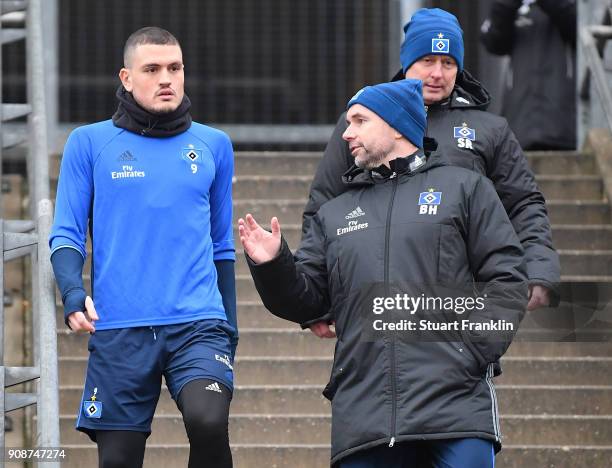 Bernd Hollerbach, new head coach of Hamburger SV talks with Kyriakos Papadopoulos during a training session of Hamburger SV at Volksparkstadion on...