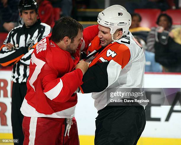 Ian Lapierre of the Philadelphia Flyers drops the gloves with Jamie Tardif of the Detroit Red Wings during the first pre-season game of the 2009-2010...