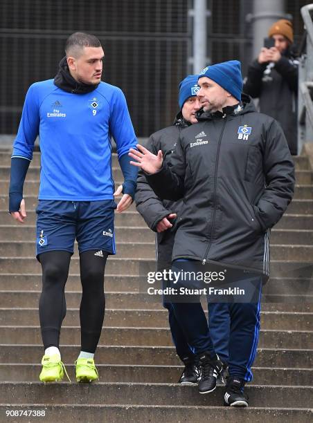 Bernd Hollerbach, new head coach of Hamburger SV talks with Kyriakos Papadopoulos during a training session of Hamburger SV at Volksparkstadion on...