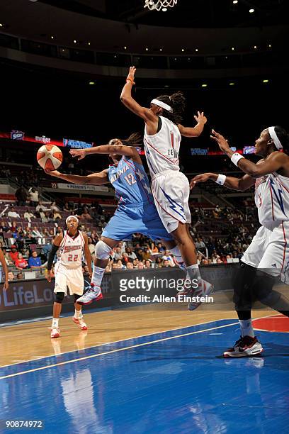 Ivory Latta of the Atlanta Dream attempts a shot against Shavonte Zellous of the Detroit Shock in Game One of the WNBA Eastern Conference Semi-Finals...