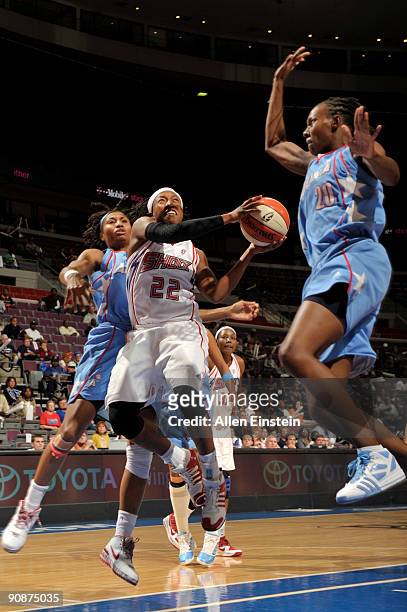 Alexis Hornbuckle of the Detroit Shock goes up for a shot attempt against Sancho Lyttle of the Atlanta Dream in Game One of the WNBA Eastern...