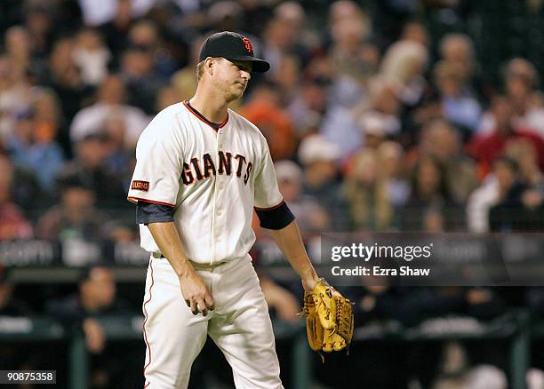 Matt Cain of the San Francisco Giants reacts after he gave up a solo home run to Troy Tulowitzki of the Colorado Rockies during their game at AT&T...