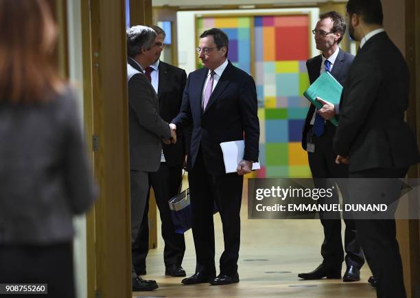 New Eurogroup Portuguese President Mario Centeno shakes hands with European Central Bank President Mario Draghi before Centeno's first Eurogroup...