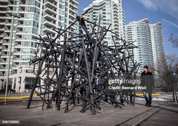Located at Lower Simcoe Wavedeck on Queens Quay, passersby admire the art installation called Black Bamboo, by artists Bennet Marburger and Ji Zhang....