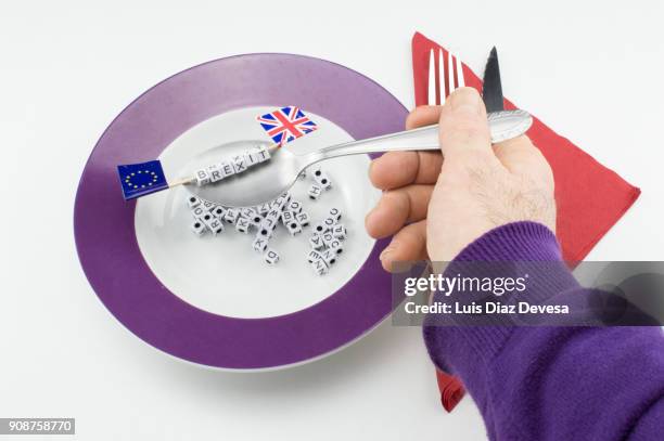 brexit word highlighted on alphabet soup letters - alphabet soup stock pictures, royalty-free photos & images