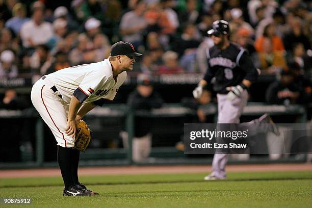 Matt Cain of the San Francisco Giants looks out to the outfield as Ian Stewart of the Colorado Rockies rounds the bases after he hit a two-run home...