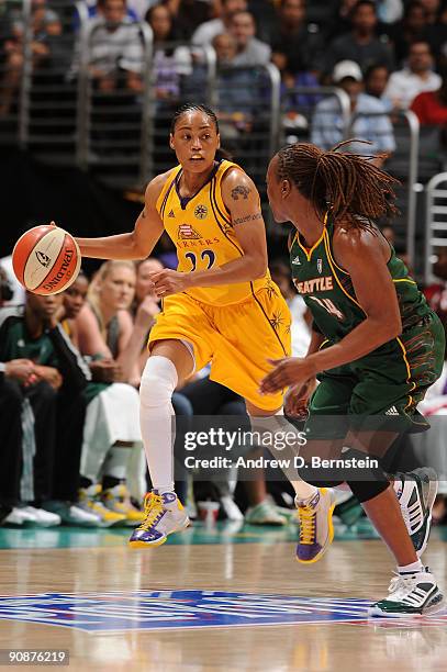 Betty Lennox of the Los Angeles Sparks drives the ball against Shannon Johnson of the Seattle Storm in Game One of the WNBA Western Conference...