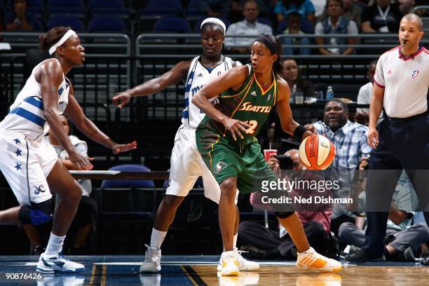 Swin Cash of the Seattle Storm goes up against Nakia Sanford and Matee Ajavon of the Washington Mystics during the WNBA game on September 3, 2009 at...