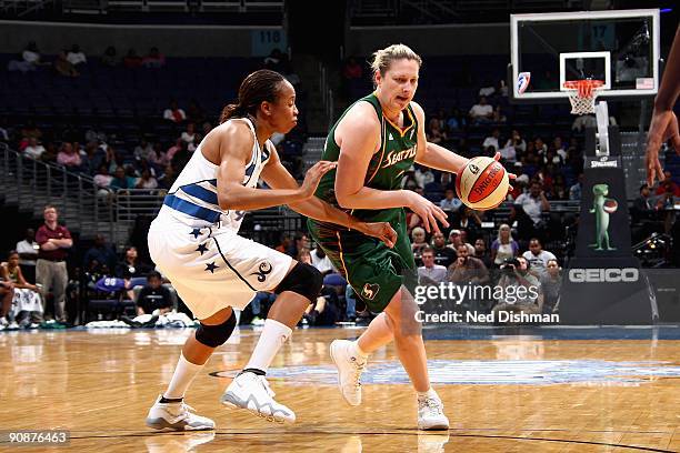 Suzy Batkovic-Brown of the Seattle Storm drives to the basket against Chastity Melvin of the Washington Mystics during the WNBA game on September 3,...