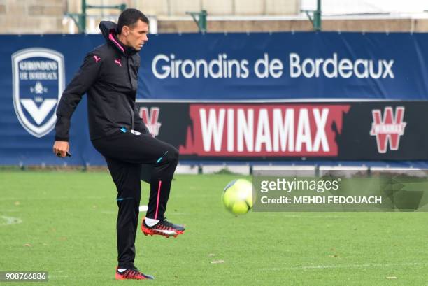 France's Ligue 1 football club Bordeaux Girondins Uruguayan new head coach Gustavo Poyet juggles a ball during his first training session as coach on...